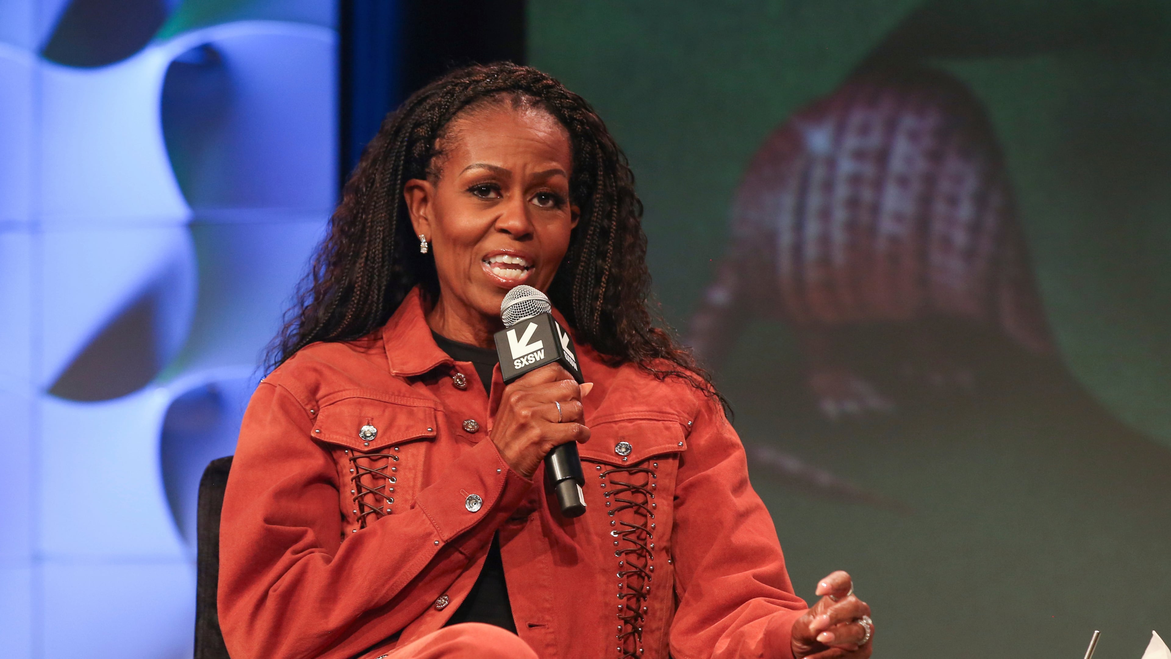 FILE - Former first lady Michelle Obama takes part in a featured session and taping of her new podcast, IMO, with her brother Craig Robinson, not pictured, at the Austin Convention Center during the South by Southwest Conference and Festival on Thursday, March 13, 2025, in Austin, Texas. (Photo by Jack Plunkett/Invision/AP, File)