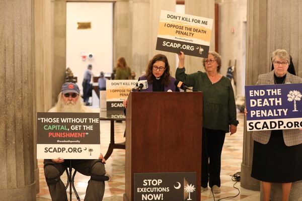 Members of South Carolinians for Alternatives to the Death Penalty speak before presenting petitions to South Carolina Gov. Henry McMaster asking him to grant clemency to Mikal Mahdi before his firing squad execution during a news conference on Thursday, April 10, 2025, in Columbia, S.C. (AP Photo/Jeffrey Collins)