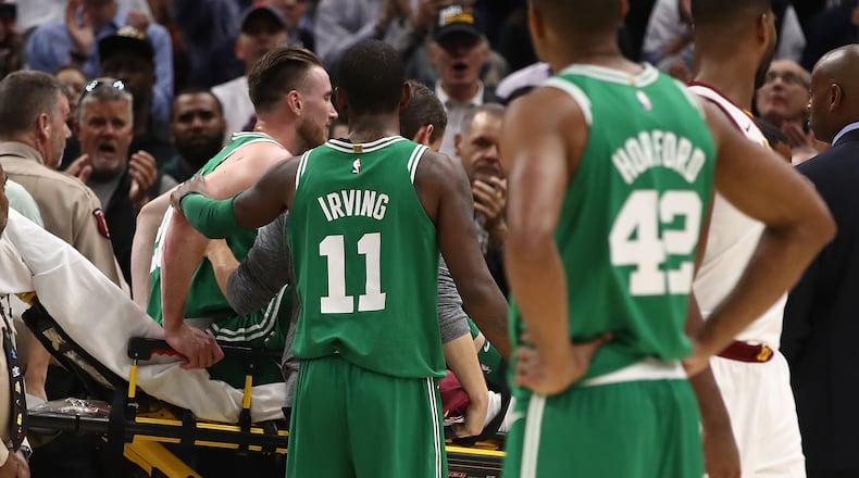 CLEVELAND, OH - OCTOBER 17: Kyrie Irving #11 of the Boston Celtics consoles Gordon Hayward #20 after Hayward was injured while playing the Cleveland Cavaliers at Quicken Loans Arena on October 17, 2017 in Cleveland, Ohio. NOTE TO USER: User expressly acknowledges and agrees that, by downloading and or using this photograph, User is consenting to the terms and conditions of the Getty Images License Agreement. (Photo by Gregory Shamus/Getty Images)