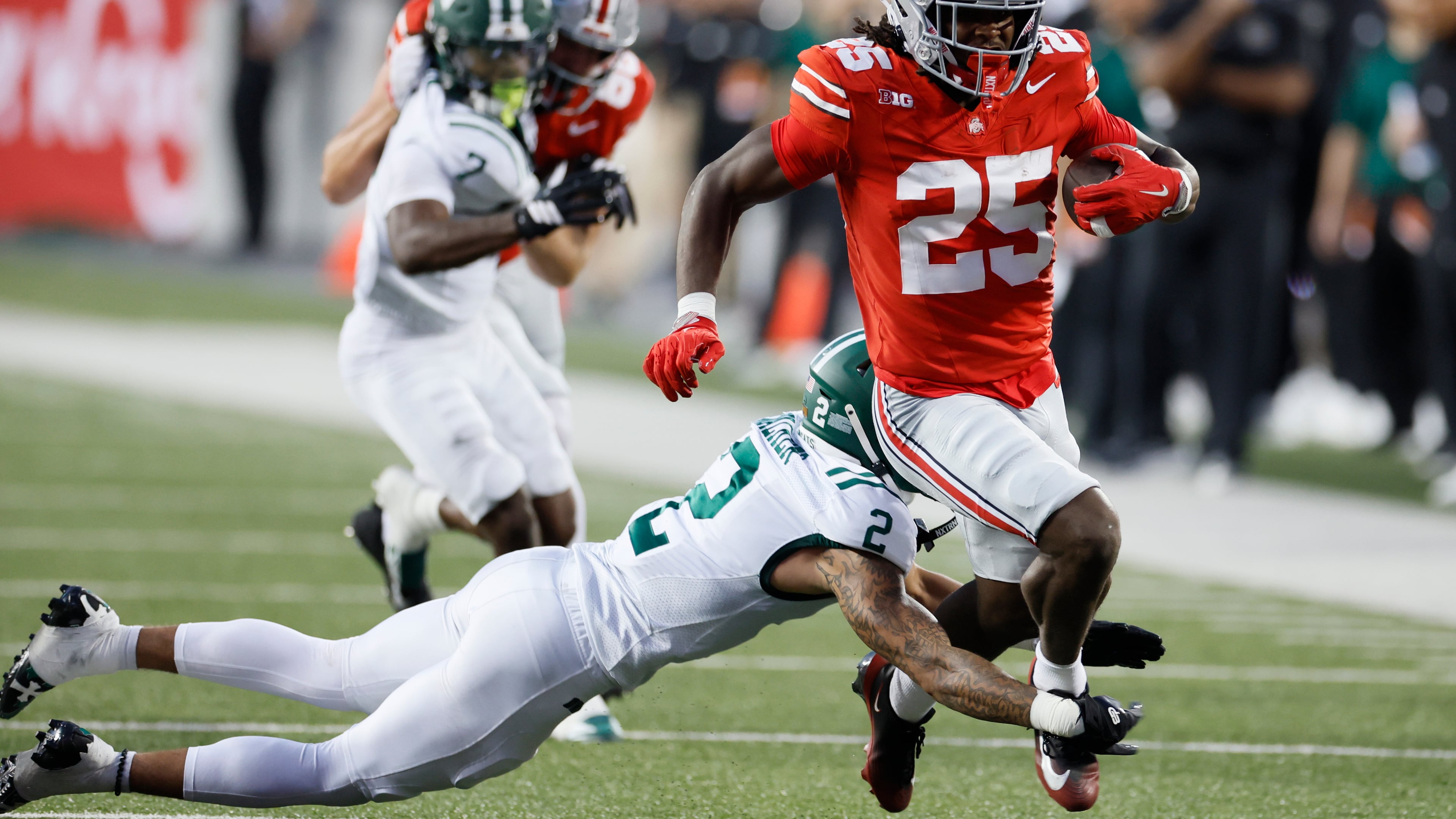 Ohio safety DJ Walker, left, tries to tackle Ohio State running back Bo Jackson during the first half of an NCAA college football game, Saturday, Sept. 13, 2025, in Columbus, Ohio. (AP Photo/Jay LaPrete)
