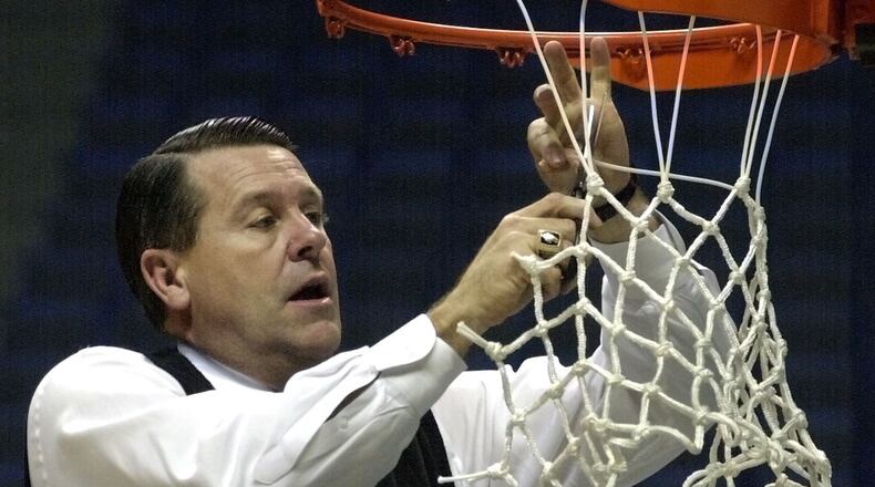 Georgia coach Andy Landers cuts down the net after his Lady Bulldogs won an SEC tournament. (AP Photo/Mark Humphrey)