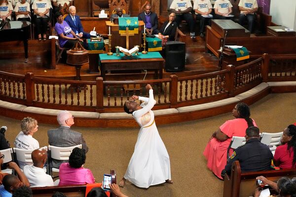 Jaala Martin dances as Former President Joe Biden watches during a Juneteenth event at the Reedy Chapel AME Church, Thursday, June 19, 2025, in Galveston, Texas. (AP Photo/David J. Phillip)