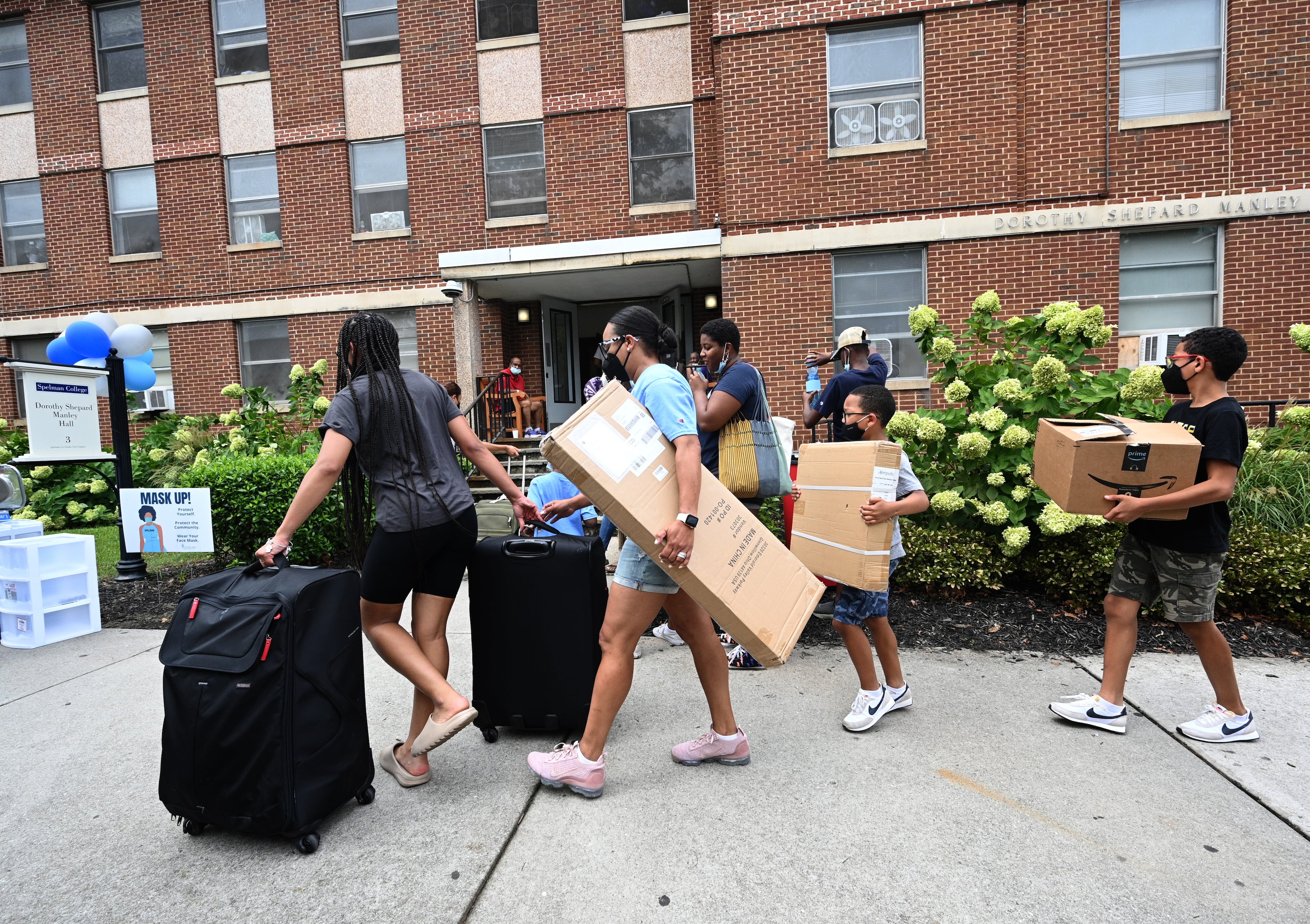 Incoming students and family members move items into Dorothy Shepard Manley Hall, one of the dorms for freshman students, at Spelman College on Wednesday, Aug. 10, 2022. (Hyosub Shin/AJC)