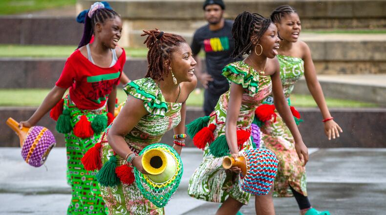 The performing arts collective Egun Omode performs at Centennial Olympic Park for the Juneteenth Atlanta Parade and Music Festival on Saturday, June 19, 2021. (Photo: Steve Schaefer for The Atlanta Journal-Constitution)