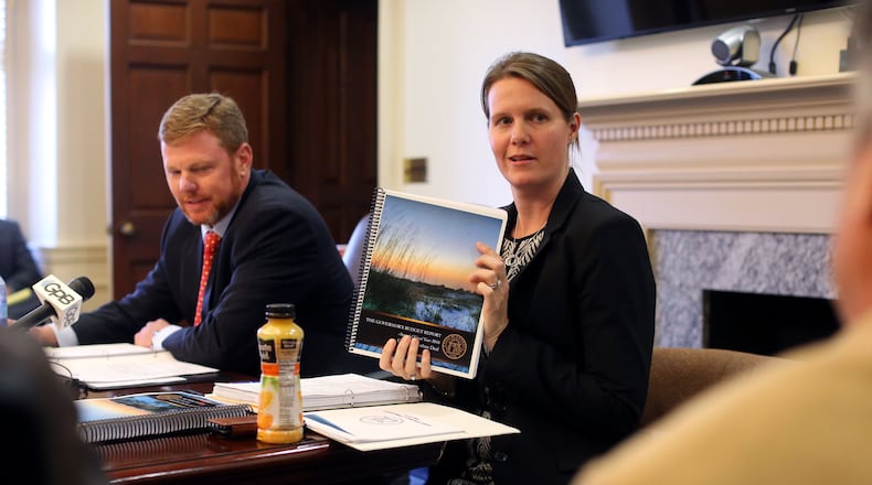 Deal administration officials, Chief of Staff Chris Riley (left) and Office of Planning and Budget Director Theresa MacCartney brief the press on the FY 2017 budget. Bob Andres, bandres@ajc.com
