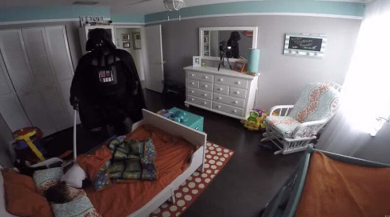 Rob Lopez wakes up son while dressed as Darth Vader. Photo via Rob Lopez/YouTube.