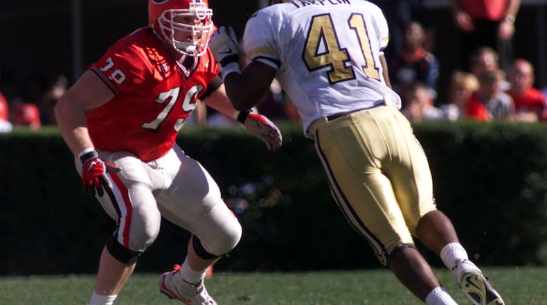 Matt Stinchcomb (79) blocks defensive end Jesse Tarplin of Georgia Tech in 1998. (KEVIN KEISTER // AJC file)