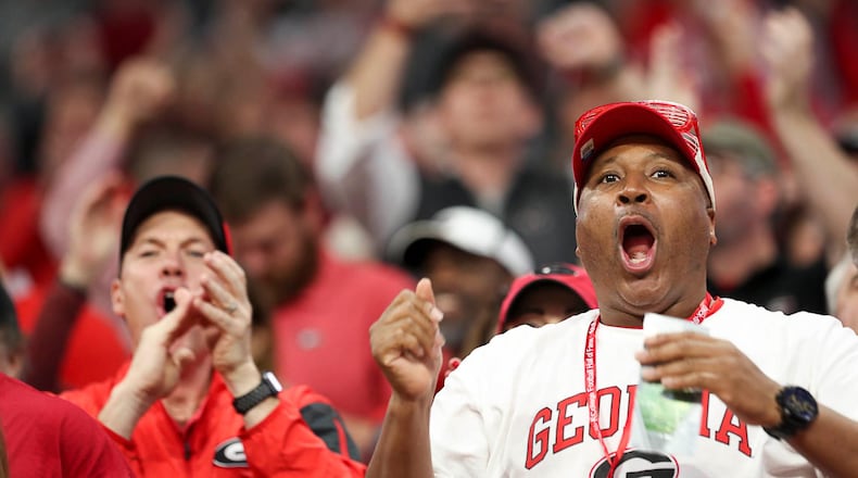 Georgia Bulldogs fans watch at Mercedes-Benz Stadium in Atlanta, Saturday, December 1, 2018. (ALYSSA POINTER/ALYSSA.POINTER@AJC.COM)