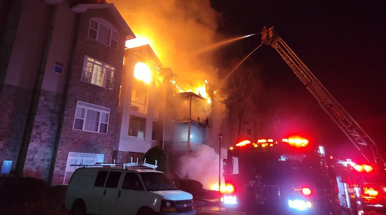 Gwinnett County firefighters battled an early Christmas morning fire that displaced at least 31 people in Duluth.