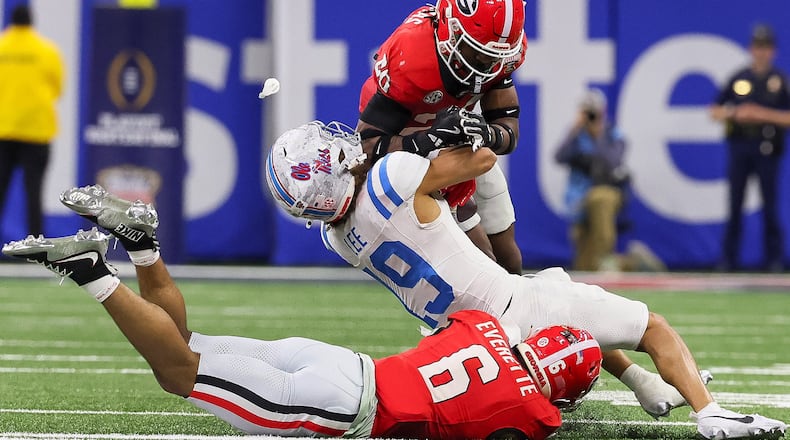 Ole Miss earned the SEC $14 million for its College Football Playoff appearances, and Georgia raked in $8 million for the conference. (Jason Getz/AJC)