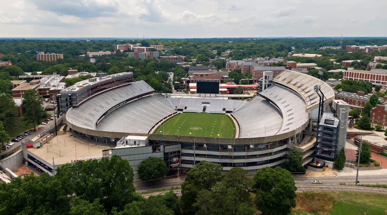 June 11, 2021 Athens - Aerial photo shows Sanford Stadium at the University of Georgia in Athens on Friday, June 11, 2021. With a $25 million expansion completed in 2003 and another $8 million in 2004, Sanford Stadium added a second upper deck on the north side and 27 new north side SkySuites bringing the new stadium capacity to 92,746Ñthe fifth largest on-campus stadium in the country. UGAÕs athletic department simply is committed to too many other facility projects that have precedence at the moment. Most notable is the $80 million football operations building that has been added to the Butts-Mehre complex. (Hyosub Shin / Hyosub.Shin@ajc.com)