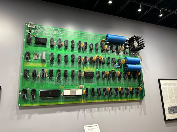 Lonnie Mimms' daughter Caroline Gryder used 3D printers to create an oversized replica of the original Apple I motherboard that Steve Wozniak made in 1976. It's at the Mimms Museum of Technology and Art. (Rodney Ho/AJC)