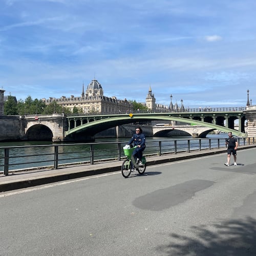 A man rides an e-bicycle in Paris. (Courtesy Dave Edwards)