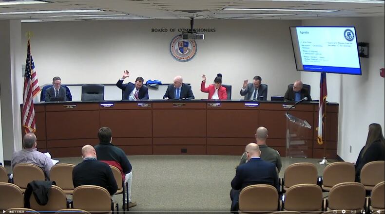 The Houston County Commission meets on Jan. 7, 2025. A Department of Justice lawsuit on Jan. 16, 2025, alleges that countywide elections weaken representation for Black voters. From left: County attorney Tom Hall and Commissioners Tal Talton, Dan Perdue, Gail Robinson, Shane Gottwals and Mark Byrd. Photo credit: Houston County Government / Facebook