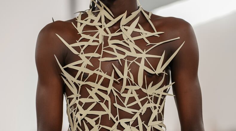 A model wears a creation as part of the Issey Miyake Homme Spring Summer 2027 collection presented in Paris, France, Thursday, June 25, 2026. (AP Photo/Aurelien Morissard)