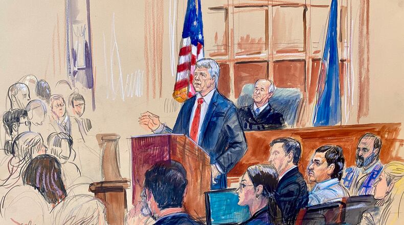 This courtroom sketch depicts Justice Department prosecutor John Gibbs speaking as defense attorneys Lauren Rosen, Geremy Kamens, from center middle seated, defendant Mohammad Sharifullah, and an interpreter, listen along with Judge Anthony John Trenga during the opening day of the trial for Sharifullah in federal court in Alexandria, Va., Monday, April 20, 2026. (Dana Verkouteren via AP)