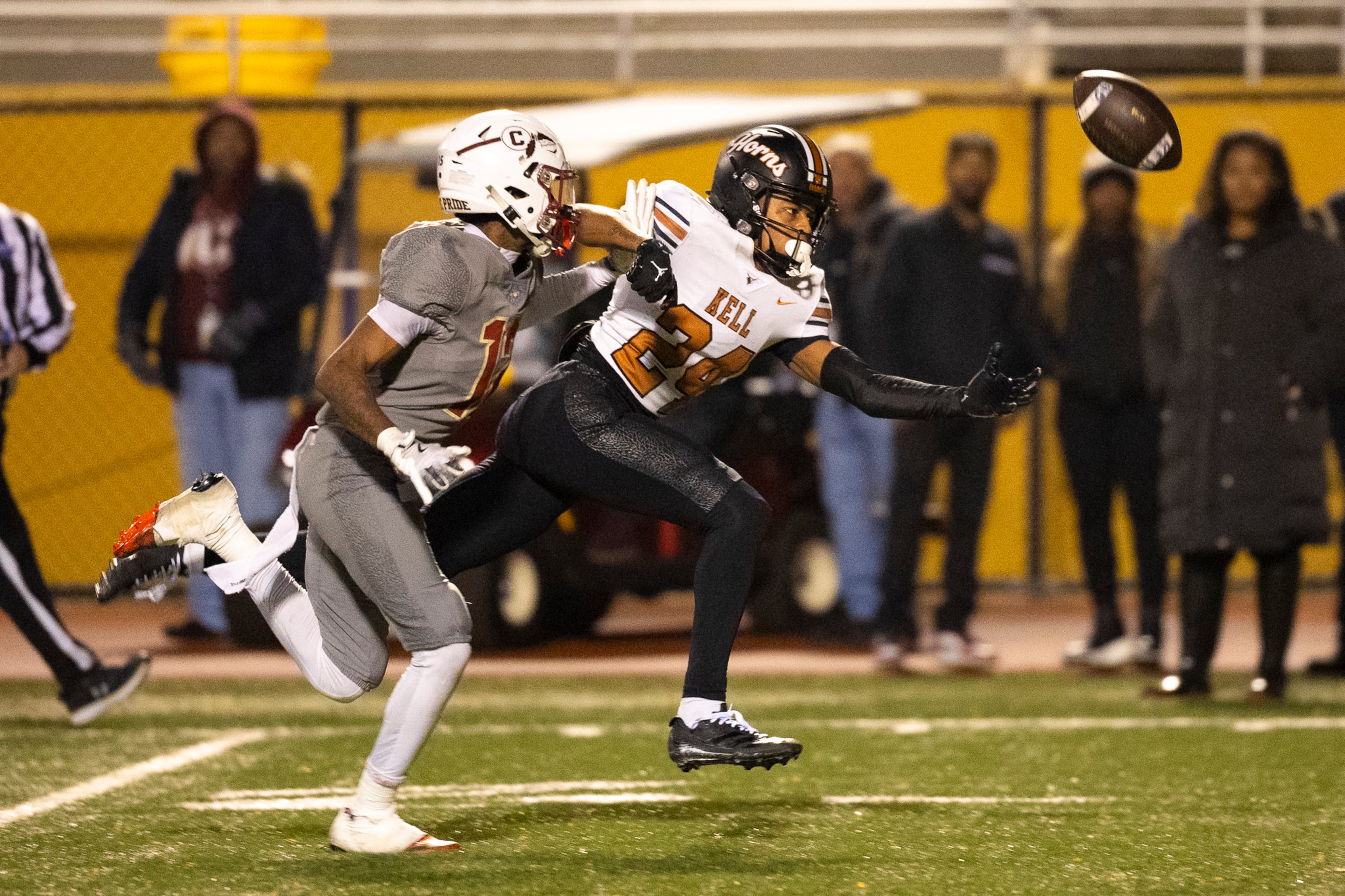 Kell defensive back Kamoni Adams (white) goes for the catch and misses during the second half of the class 4A semifinal against Creekside at Creekside High School in Fairburn, GA on Friday, December 5, 2025. (Oscar Guevara Saenz for the AJC)
