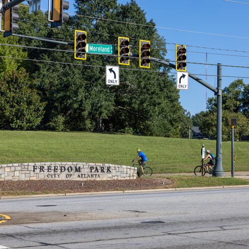 Bikers riding by Freedom Park sign at Poncey-Highland on September 24, 2022