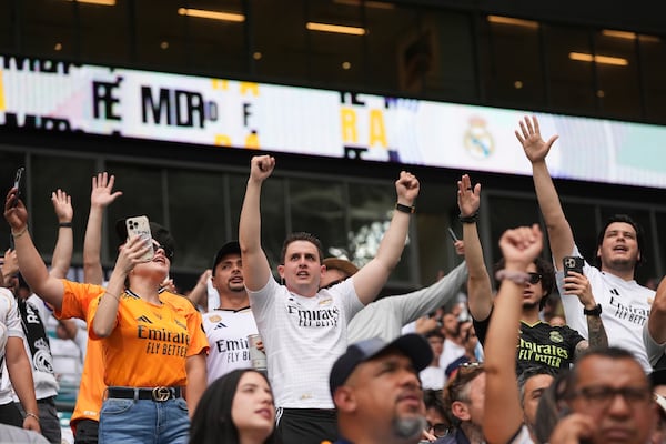Real Madrid fans cheer their team before the Club World Cup round of 16 soccer match between Real Madrid and Juventus in Miami Gardens, Fla., Tuesday, July 1, 2025. (AP Photo/Lynne Sladky)