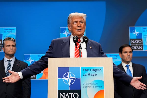 President Donald Trump speaks during a media conference at the end of the NATO summit as Foreign Secretary Marco Rubio, right, and Defence Secretary Pete Hegseth listen, in The Hague, Netherlands, Wednesday, June 25, 2025. (AP Photo/Alex Brandon)