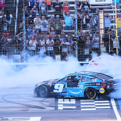 Chase Elliott does a burnout at the finish line after winning a NASCAR Cup Series auto race in Fort Worth, Texas, Sunday, May 3, 2026. (AP Photo/LM Otero)