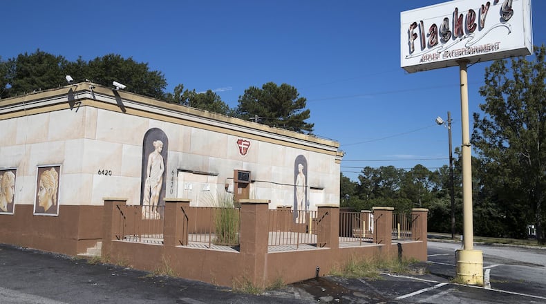 09/14/2018 — Sandy Springs, Georgia — The exterior of Flasher’s Adult Entertainment in Sandy Springs, Friday, September 14, 2018. Sandy Springs’ three “adult entertainment” clubs closed earlier this month, after the city fought 12 years to enforce an ordinance prohibiting alcohol sales at such establishments. (ALYSSA POINTER/ALYSSA.POINTER@AJC.COM)
