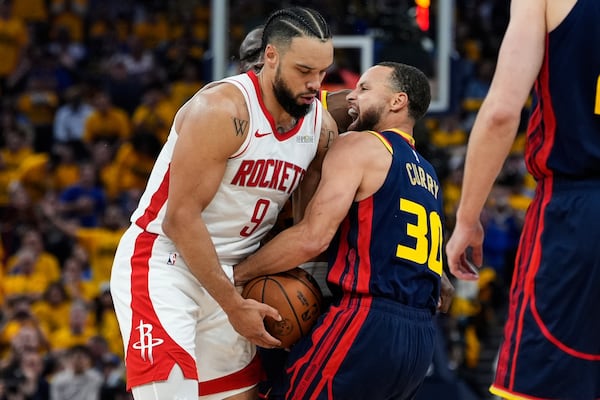 Golden State Warriors guard Stephen Curry (30) confronts Houston Rockets forward Dillon Brooks (9) during the first half of Game 4 of an NBA basketball first-round playoff series Monday, April 28, 2025, in San Francisco. (AP Photo/Godofredo A. Vásquez)