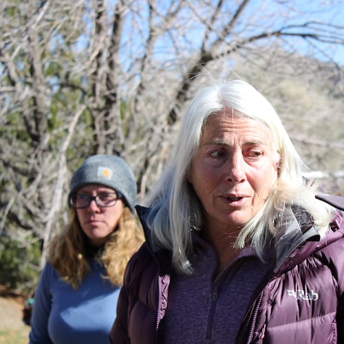 Franci Stagi, center, stands on Oct. 28, 2025, in in Durango, Colo., after she was allegedly assaulted by an immigration officer outside the U.S. Immigration and Customs Enforcement field office. (Christian Burney/Durango Herald via AP)