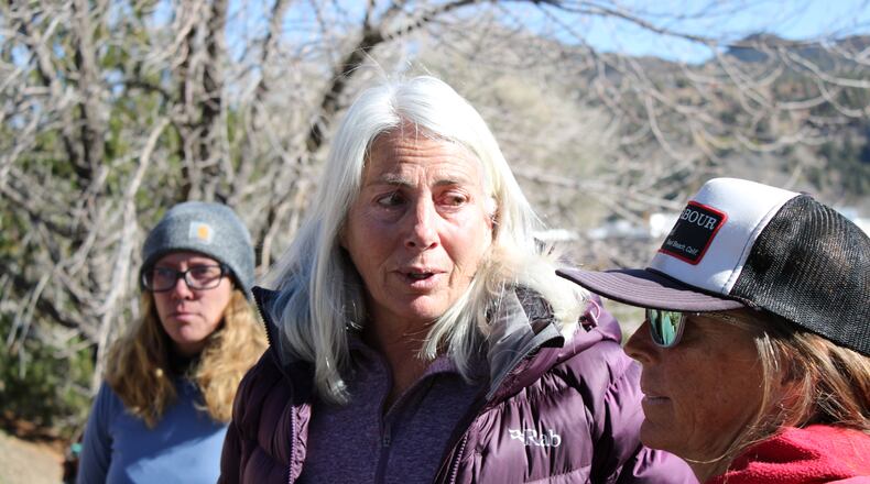Franci Stagi, center, stands on Oct. 28, 2025, in in Durango, Colo., after she was allegedly assaulted by an immigration officer outside the U.S. Immigration and Customs Enforcement field office. (Christian Burney/Durango Herald via AP)