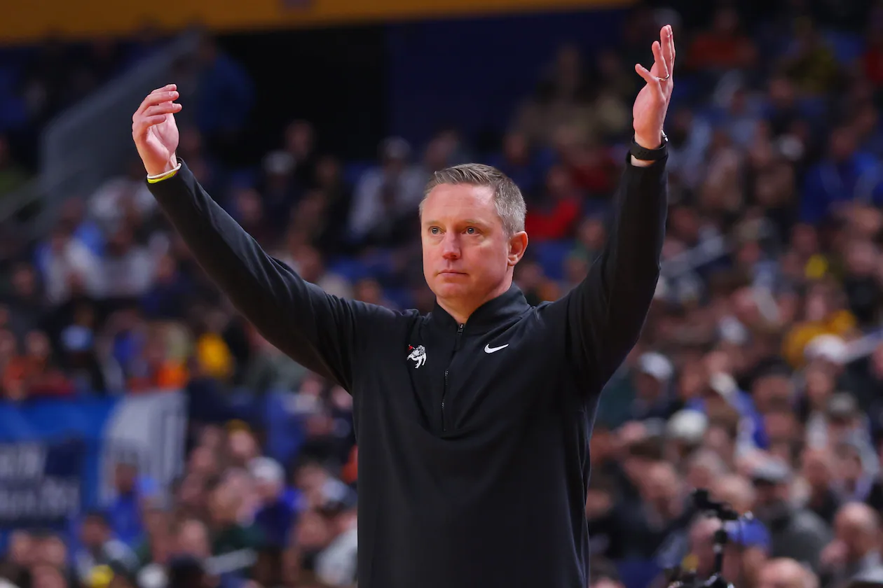Georgia head coach Mike White throws his hands up during the first round of the NCAA Tournament against Saint Louis on Thursday, March 19, 2026, in Buffalo, N.Y. It was White’s second appearance in the tournament since taking over the program. (Jeffrey T. Barnes/AP)