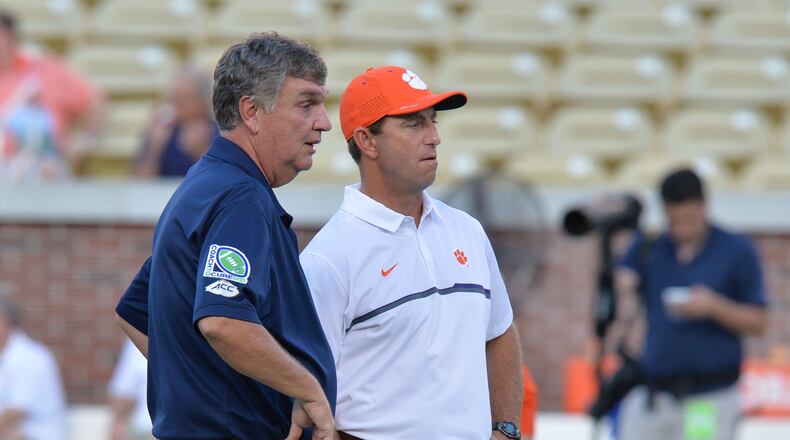 September 22, 2016 Atlanta - Georgia Tech Yellow Jackets head coach Paul Johnson (left) and Clemson Tigers head coach Dabo Swinney talk before their game at Bobby Dodd Stadium on Thursday, September 22, 2016. HYOSUB SHIN / HSHIN@AJC.COM