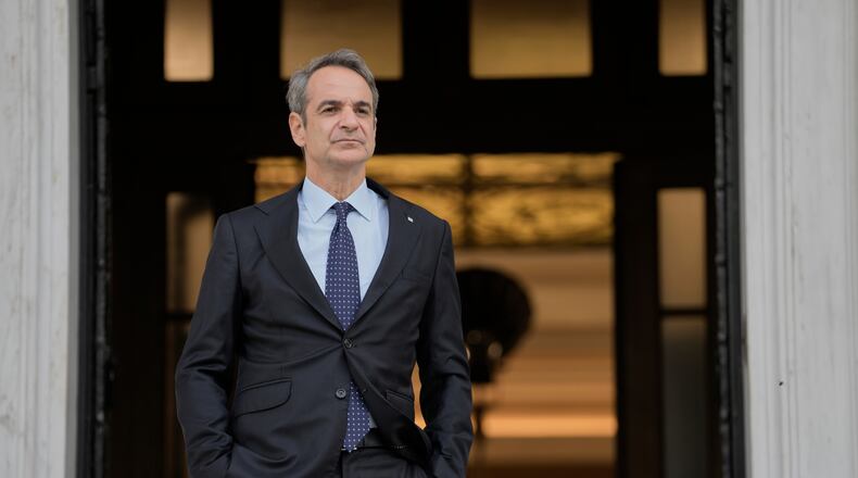 FILE - Greece's Prime Minister Kyriakos Mitsotakis waits for the arrival of the European Parliament president in Athens, April 9, 2025. (AP Photo/Petros Giannakouris)