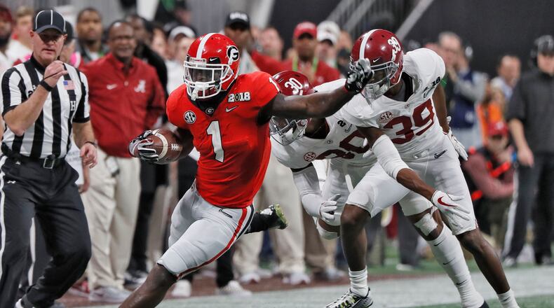 Georgia Bulldogs running back Sony Michel (1) on a big first quarter run that set up a Georgia field goal. BOB ANDRES /BANDRES@AJC.COM