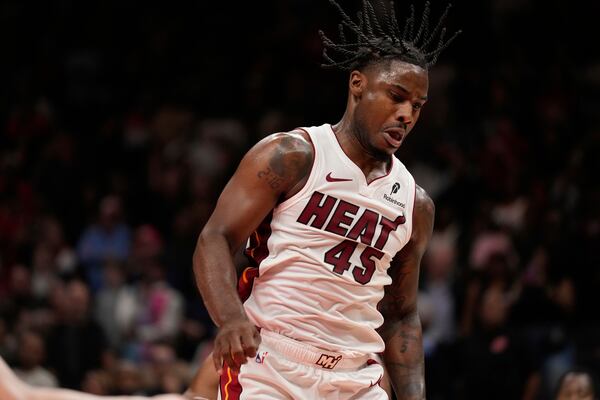 Miami Heat guard Davion Mitchell (45) is seen in overtime of an NBA play-in tournament basketball game against the Atlanta Hawks, Friday, April 18, 2025, in Atlanta. (AP Photo/Brynn Anderson)