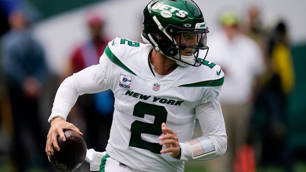 New York Jets quarterback Zach Wilson looks to pass on th run during the first half against the Tennessee Titans, Sunday, Oct. 3, 2021, in East Rutherford, N.J. (Seth Wenig/AP)