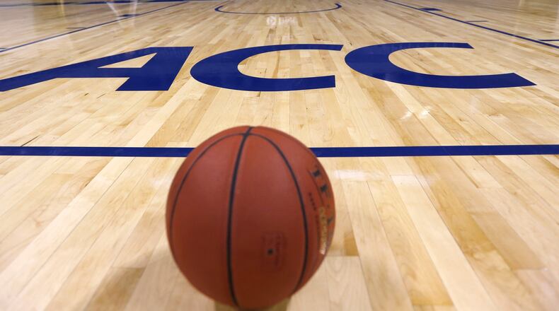 A basketball sets near the foul line near the new ACC logo on the playing floor of the Petersen Event Center during the NCAA college basketball team's annual media day on Thursday, Sept. 26, 2013, in Pittsburgh. The 2013-14 basketball season will be Pittsburgh's first in the ACC. (AP Photo/Keith Srakocic)