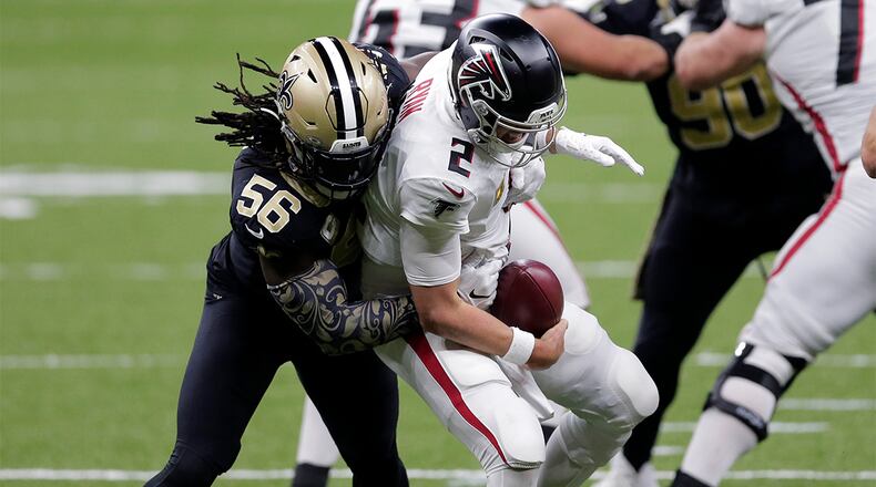 Falcons quarterback Matt Ryan (2) is sacked by Saints outside linebacker Demario Davis (56) in the second half Sunday, Nov. 22, 2020, in New Orleans. (Brett Duke/AP)