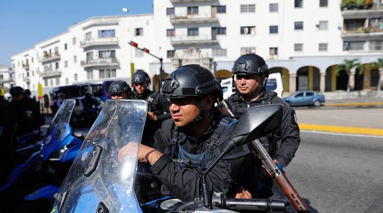 Police patrol in downtown Caracas, Venezuela, Monday, Jan. 5, 2026. (AP Photo/Cristian Hernandez)