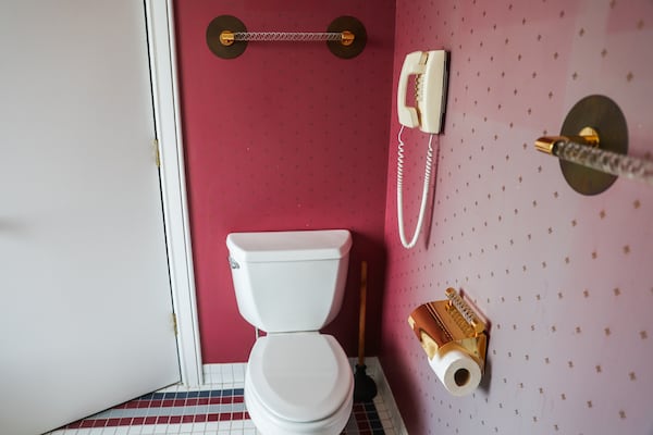 A phone hangs on the wall next to the toilet in the bathroom at Ted Turner’s loft apartment at the former CNN Center in Atlanta on Monday, May 11, 2026. (Abbey Cutrer/AJC)