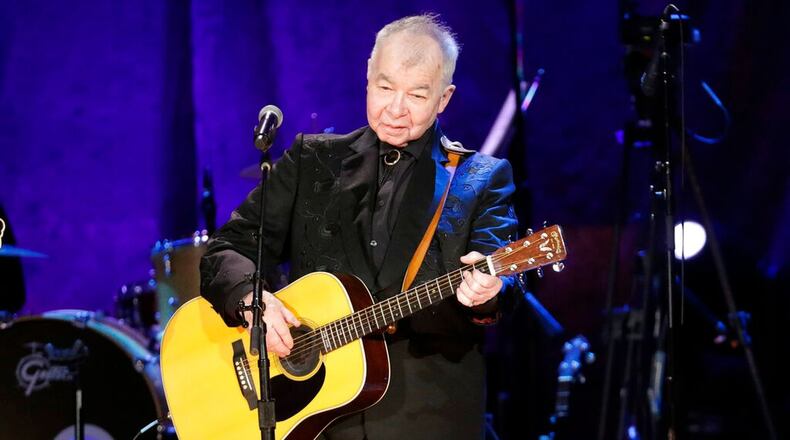 In this Sept. 11, 2019, file photo, John Prine performs at the Americana Honors & Awards show in Nashville, Tenn. Prine died April 7, 2020, from complications of the coronavirus. He was 73. (AP Photo/Wade Payne, File)
