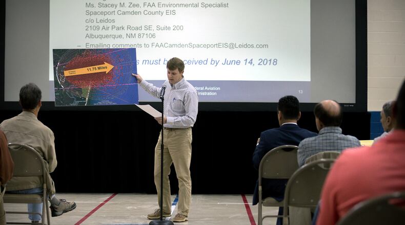 KINGSLAND, GA - APRIL 11, 2018: Camden County resident Kevin Lang, center, holds a graphic showing a model explosion pattern from a FAA study of a Falcon One Rocket during a public hearing to discuss during a public hearing about a potential site for a spaceport in Kingsland, Georgia. (AJC Photo/Stephen B. Morton)