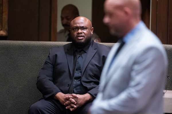 Desmond Mills Jr., a former Memphis Police Department officer who has taken a plea deal, answers a question from Shelby County deputy district attorney Paul Hagerman, right, during the second day of the state trial for the death of Nichols at 201 Poplar in Memphis, Tenn., on Tuesday, April 29, 2025. (Chris Day/Commercial Appeal/USA Today Network via AP, Pool)