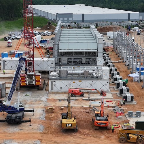 An aerial view shows off-grid generators being installed in front of a data center in Covington on Thursday, June 25, 2026. (Hyosub Shin/AJC)