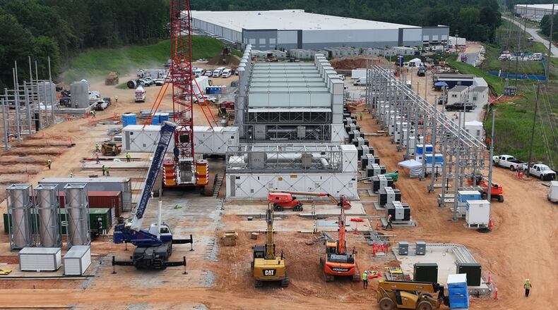 An aerial view shows off-grid generators being installed in front of a data center in Covington on Thursday, June 25, 2026. (Hyosub Shin/AJC)