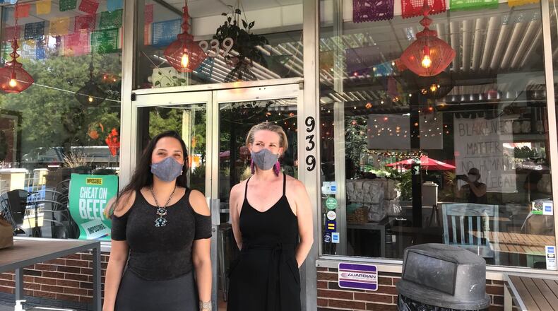 Jarina Naone (left) and Rosa Thurnher are the co-owners of El Ponce restaurant and El Bar. LIGAYA FIGUERAS / LIGAYA.FIGUERAS@AJC.COM