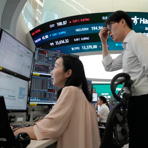 Currency traders watch monitors at the foreign exchange dealing room of the Hana Bank headquarters in Seoul, South Korea, Tuesday, July 7, 2026. (AP Photo/Ahn Young-joon)