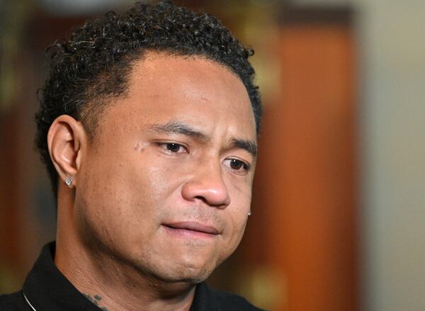 March 31, 2021 Norcross - A tear runs down the cheek of Robert Peterson, younger son of one of Atlanta spas shooting victims, Yong Ae Yue, as he recalls his late mother in Norcross on Wednesday, March 31, 2021. (Hyosub Shin / Hyosub.Shin@ajc.com)