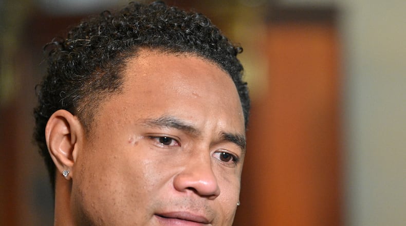 March 31, 2021 Norcross - A tear runs down the cheek of Robert Peterson, younger son of one of Atlanta spas shooting victims, Yong Ae Yue, as he recalls his late mother in Norcross on Wednesday, March 31, 2021. (Hyosub Shin / Hyosub.Shin@ajc.com)