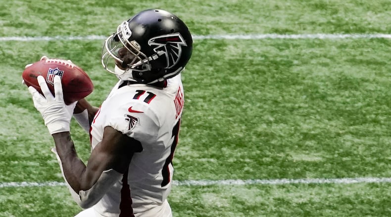 Atlanta Falcons wide receiver Julio Jones (11) lands in the end zone for a touchdown against the Denver Broncos during the second half Sunday, Nov. 8, 2020, in Atlanta. (Brynn Anderson/AP)
