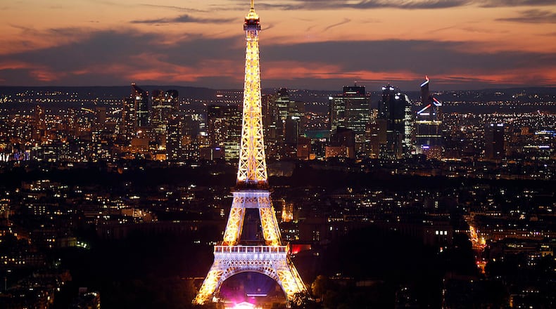 The Eiffel Tower is shown lit up in Paris, France. (Photo by Thierry Chesnot/Getty Images)